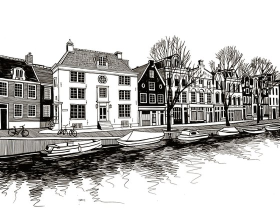 Boats and houses on a canal of Amsterdam, Netherlands.