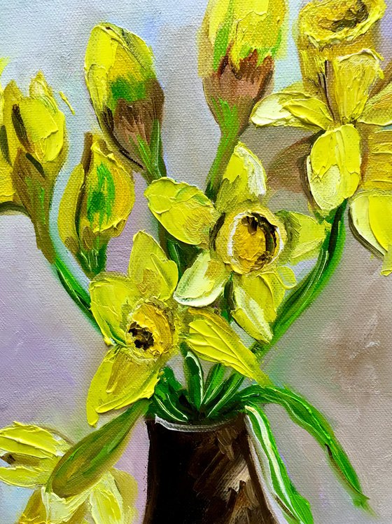 Bouquet of Daffodils on red table, still life inspired by spring.