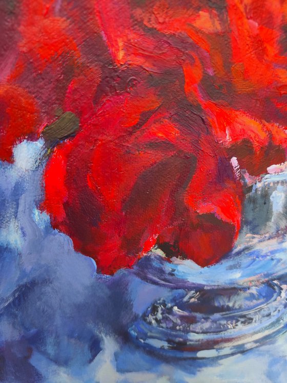 Red roses in a metal vase
