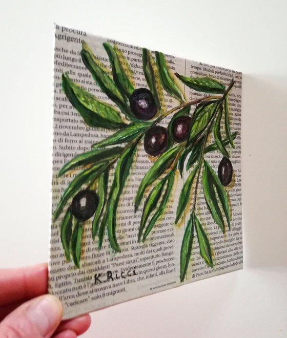 "Olives Branch on Newspaper"