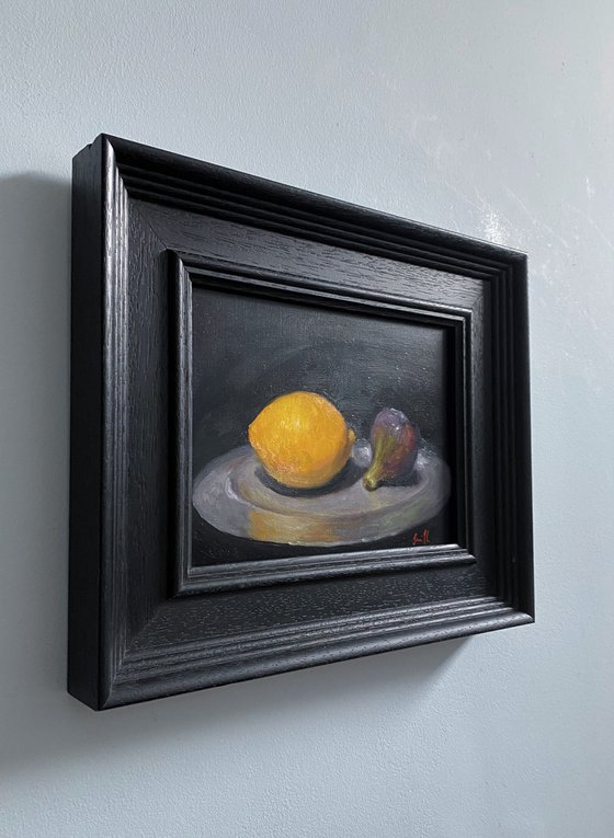 A Lemon, a fig & a Pewter Plate.