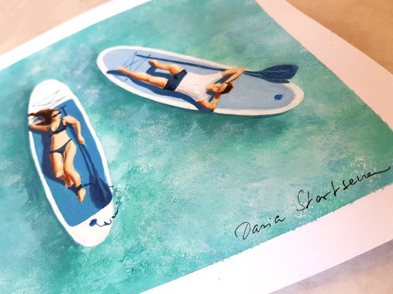 Couple on Sup boards