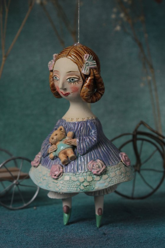 Little Girl in an blue dress with a teddy. Hanging sculpture, bell doll by Elya Yalonetski