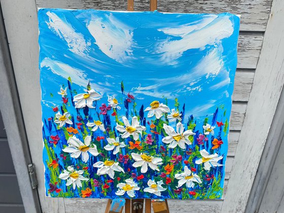 Daisies at the meadow. Impasto painting