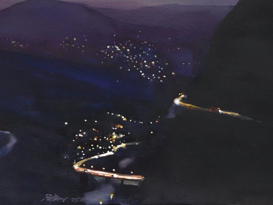 Night lights, moutain road