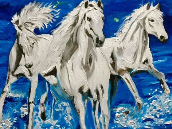 White horses running on the waves.