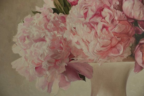 Bouquet of peonies in a white vase