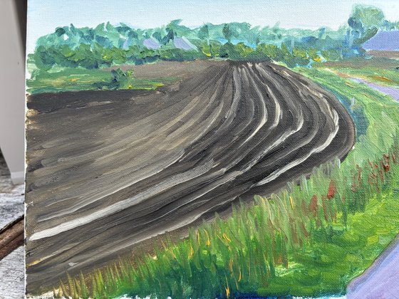 Plowed field, road and windmill . Plein Air