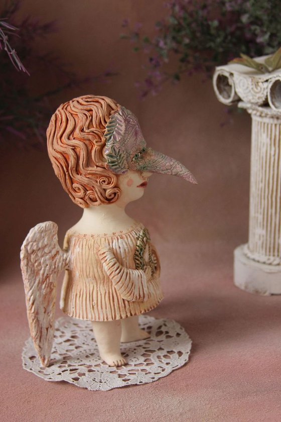 Angel holding a wreath. Ceramic OOAK sculpture.