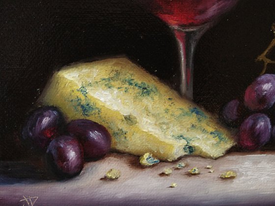 Red wine with cheese and grapes still life