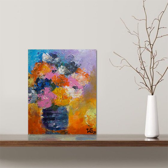 Small still life with orange, pink and blue flowers