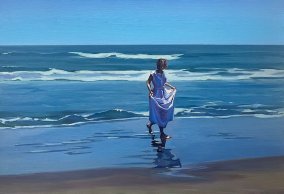 Walk by the ocean. Girl in a white dress